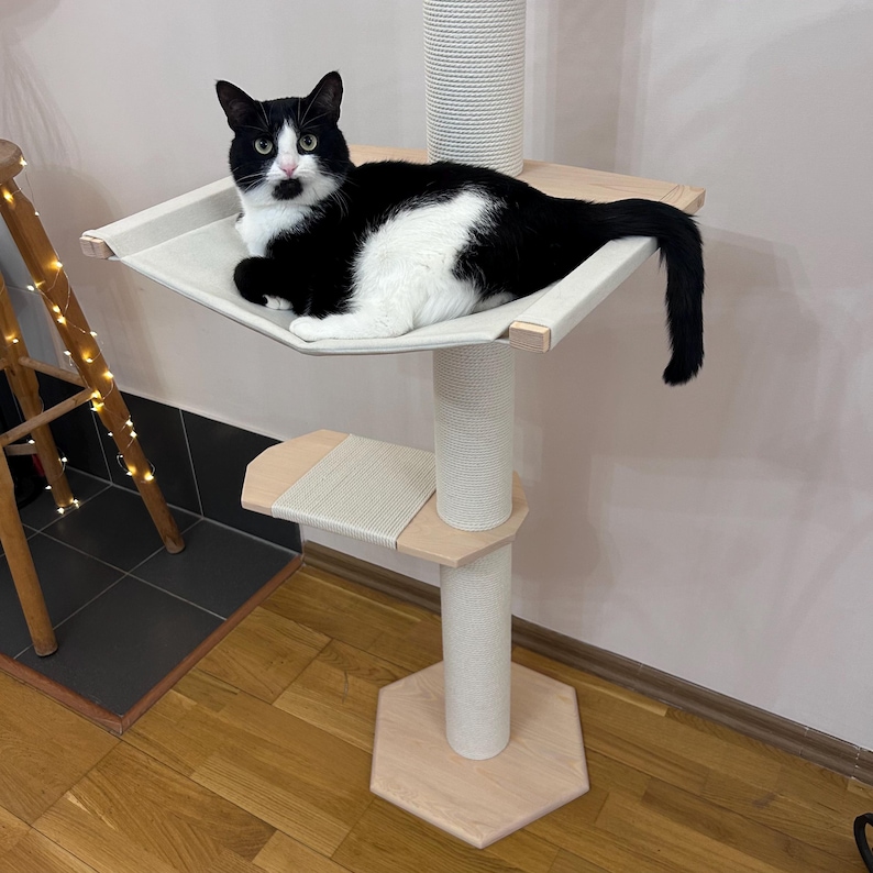 Adjustable floor to ceiling cat tree, wooden cat tower with hammock and soft Velcro-secured cushion, eco-friendly design with durable scratching posts, ideal for large cats to climb, rest, and scratch comfortably in any home or apartment