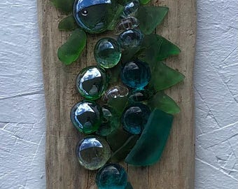 Sea glass, seahorse on natural driftwood wall hanging.