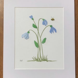 Beautiful blue sea glass flowers with a bumble bee wall hanging
