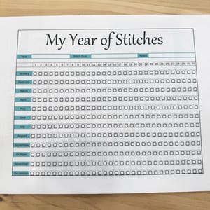 May include: A printable year-long stitching tracker with a teal header and black boxes for each day of the year. The header says "My Year of Stitches".