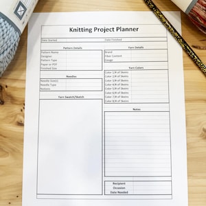 May include: Printable knitting project planner with sections for pattern details, yarn details, yarn colors, notes, and recipient information. The planner includes fields for pattern name, designer, pattern type, paper or PDF, finished size, needle size, needle type, notions, yarn swatch, brand, fiber content, gauge, and date started and finished.