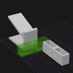May include: A white phone stand with a green and white storage box with two compartments. The storage box is attached to the phone stand.