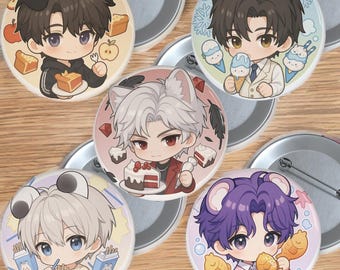 May include: A collection of five round pinback buttons featuring anime-style illustrations of characters with animal ears. Each button has a unique design, including food items like cake, ice cream, and fish-shaped pastries. The buttons have a metal backing.