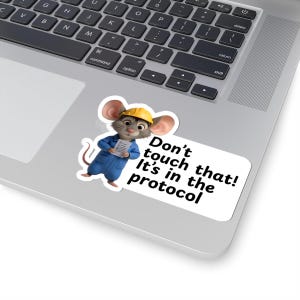 May include: A sticker with a cartoon mouse in a yellow hard hat and blue overalls, holding a clipboard. The sticker has the text "Don't touch that! It's in the protocol" in black font.