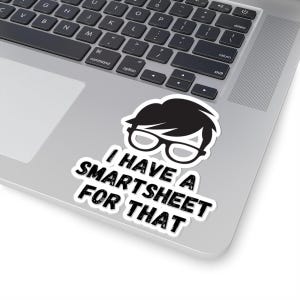May include: A black and white sticker featuring a cartoon character wearing glasses and the text "I have a Smartsheet for that."