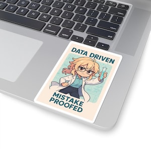 May include: A rectangular sticker featuring an anime-style scientist in a lab coat holding a test tube. The sticker has the text "DATA DRIVEN" at the top and "MISTAKE PROOFED" at the bottom. The background is a light beige color.