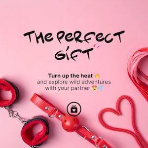 May include: Pink background with the text "The Perfect Gift". The image features red restraints, a red ball gag, and a heart-shaped rope. The text "Turn up the heat and explore wild adventures with your partner" is also included.