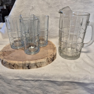 MCM glass anchor hocking tartan plaid pitcher and four matching glasses.
