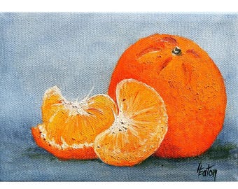 May include: A painting of a whole orange and two orange segments on a blue background. The orange is bright orange and the segments are a lighter orange.