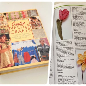 May include: A book titled "The Colour Library Book of Creative Needle Crafts" with a yellow cover and colourful images of various needle crafts, including knitting, crochet, embroidery, patchwork, appliqué, and quilting.