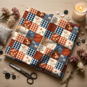 May include: A square fabric piece featuring a patchwork design of alternating squares. The pattern includes blue and white gingham, orange and white gingham, and various floral illustrations on cream backgrounds. The fabric is laid flat.