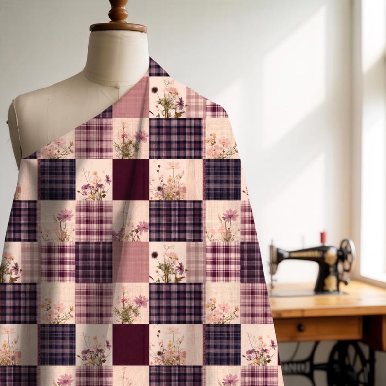 May include: A fabric draped over a mannequin featuring a checkered pattern of alternating squares. Some squares display a dark purple and white plaid design, while others feature a light cream background with printed wildflower bouquets.