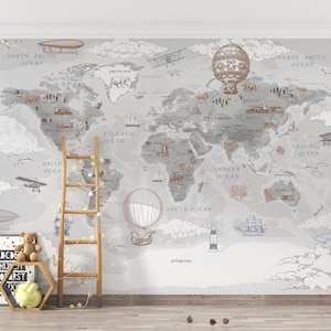 May include: A grey world map mural featuring vintage illustrations of hot air balloons, aeroplanes, and ships. The map includes the text "NORTH ARCTIC OCEAN", "ATLANTIC OCEAN", "PACIFIC OCEAN", "INDIAN OCEAN", and "SOUTH OCEAN". A wooden ladder and decorative items are in front of the mural.