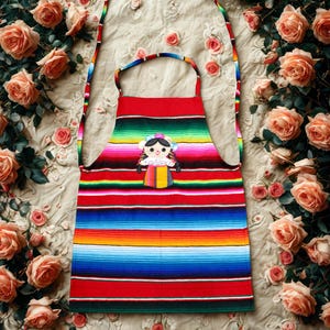 Handmade Mexican Apron with Muñequita Doll Embroidery – Colorful Serape Fabric Kitchen Apron with Pockets. Mexican Doll Sarape Apron