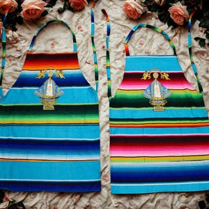 Handmade Mexican Apron with La Virgen de San Juan de los Lagos – Colorful Serape Apron with Front Pockets. Virgen de San Juan Sarape Apron