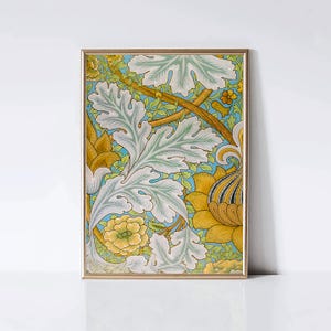 May include: A framed botanical print featuring a detailed floral pattern. The artwork showcases large, stylized leaves in shades of white and pale green, set against a light blue background. Yellow and gold flowers and stems complete the design.