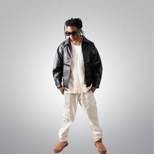 Męska czarna skórzana kurtka typu bomber w stylu oversize, skórzana odzież wierzchnia, męskie stylizacje vintage, modna skórzana kurtka, zamek błyskawiczny YKK, prezenty świąteczne