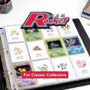 May include: A black binder with clear plastic pages containing various trading cards. The cards feature illustrations of characters like Alakazam, Blastoise, Charizard, Dragonite, Dugtrio, Dark Golbat, Dark Gyarados, Dark Hypno, and Slowbro.