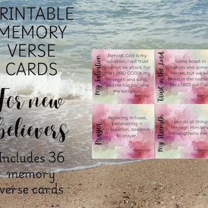 May include: Printable memory verse cards for new believers. The cards feature watercolor backgrounds with Bible verses. The text includes "My Salvation", "Trust in the Lord", "Prayer", and "My Strength". The cards are displayed on a beach.