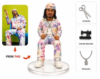 May include: A figurine of a person wearing a tie-dye jacket, pants, and a baseball cap. The figure is seated on a clear circular base. The image includes a photo of the person in the outfit and icons of scissors, a sewing machine, and a necklace.