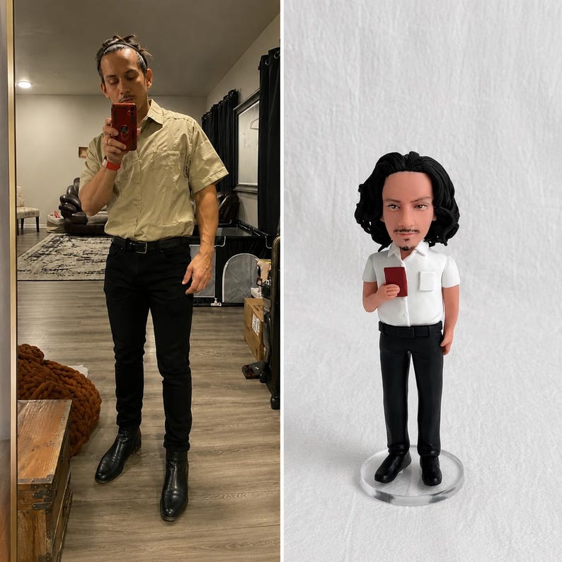May include: A custom bobblehead figurine featuring a person with dark wavy hair and a goatee, wearing a white short-sleeved collared shirt, black trousers, and black shoes. The figure holds a small red rectangular object in the right hand.