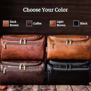 May include: Four leather toiletry bags in dark brown, coffee, light brown, and black. Each bag has a zippered main compartment and a front zippered pocket. The text "Choose Your Color" is at the top of the image.