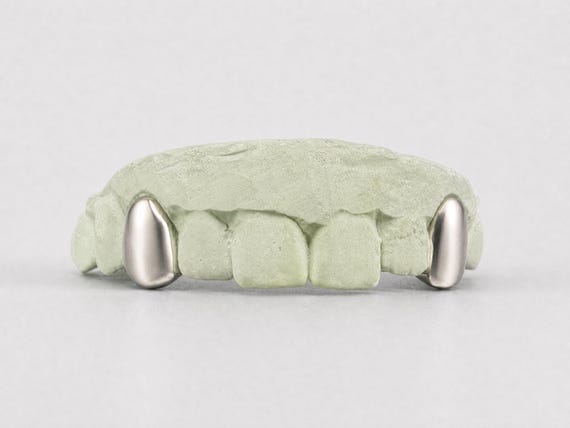 Custom Fit Silver/Gold Grillz: Solid Fang Teeth Caps