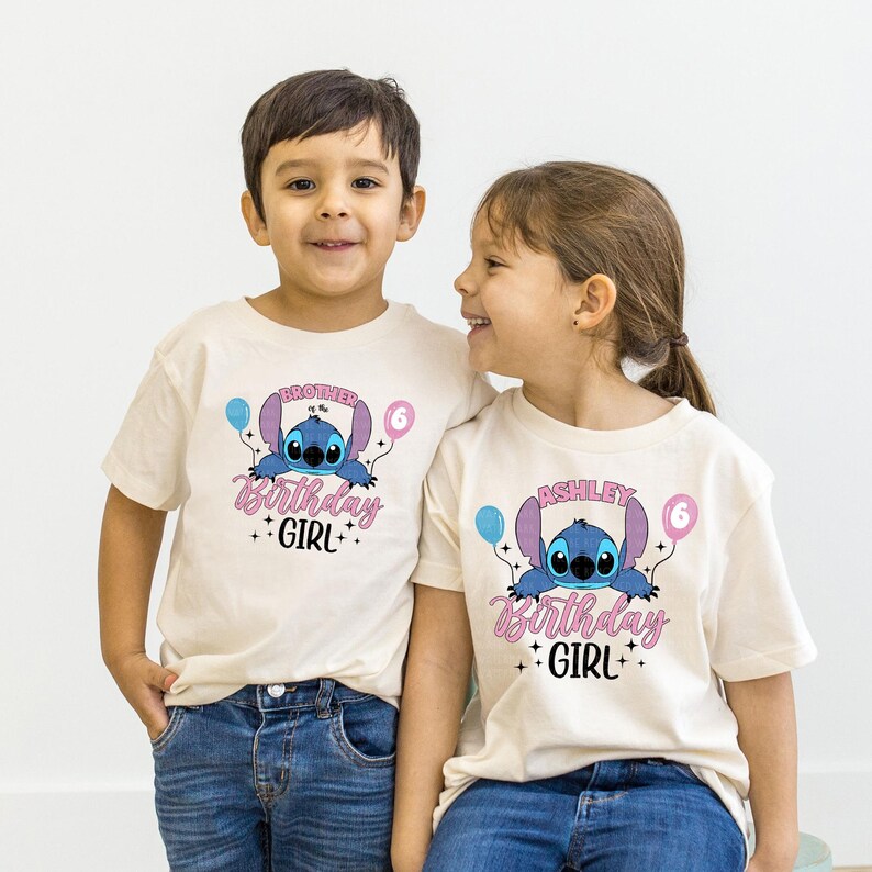 a couple of kids sitting next to each other