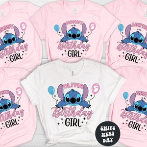 A collection of pink t-shirts with a cartoon character and text printed on them, likely representing a birthday theme.