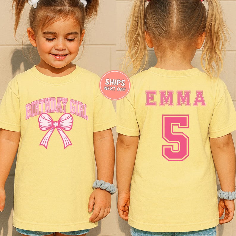 A young girl wearing a yellow t-shirt with a pink bow and the text "BIRTHDAY GIRL" printed on it.