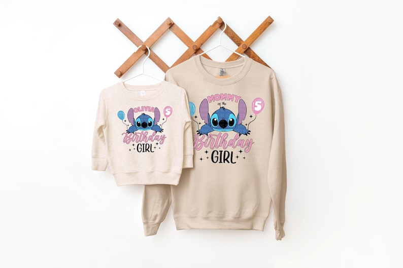 a couple of sweatshirts hanging on a wall