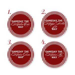 May include: Four circular stickers with a dark red background and white vertical stripes along the edges. Each sticker features the white text GAMEDAY THE [Greek Letter Name] WAY, with the specific names Alpha Chi, Alpha Delta Pi, Alpha Gam, and Alpha Xi.