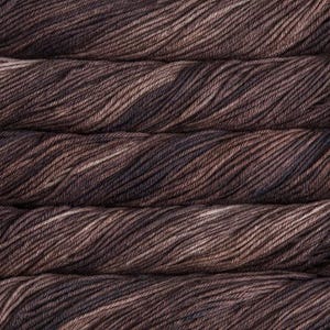 Malabrigo Rios Coco Tonal Espresso Superwash Merino Yarn skeins stacked, showcasing soft brown and dark brown hues with subtle texture, from Malabrigo, a premium yarn brand known for quality and color.