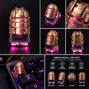 May include: A bronze-colored mechanical keyboard keycap featuring a segmented, helmet-like design with horizontal cutouts revealing a bright pink internal light. The keycap is shown from multiple angles and installed on a black keyboard.