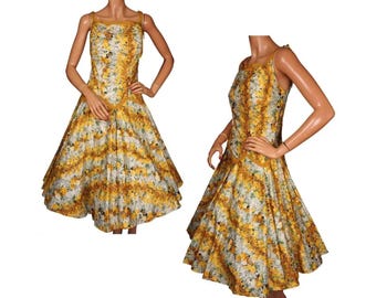 May include: A yellow and white floral print dress with a full skirt and a fitted bodice. The dress has a scoop neckline and thin straps.