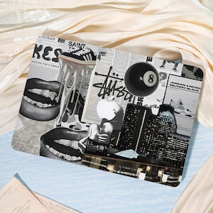 May include: A collage-style tray featuring a black eight ball, newspaper clippings, and a black and white image of lips. The tray also includes images of sneakers, buildings, and the Stussy logo. The background is a light beige fabric.
