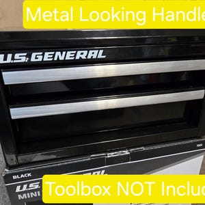May include: Black two-drawer toolbox with silver metal-looking handles. The toolbox has the text "U.S. GENERAL" printed on the front. The text "Toolbox NOT Included" is printed on a yellow background below the toolbox.