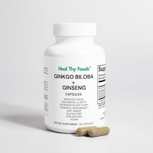 May include: White bottle with a green label that reads "Heal Thy Foods" Ginkgo Biloba + Ginseng Capsules. The label also states "Improves Focus and Mental Clarity", "Increases Blood Flow", "Powerful Antioxidant", "Anti-Aging", "Gluten-Free", "100% Natural", "Vegan", and "Dietary Supplement 60 Capsules". Two brown capsules are in front of the bottle.