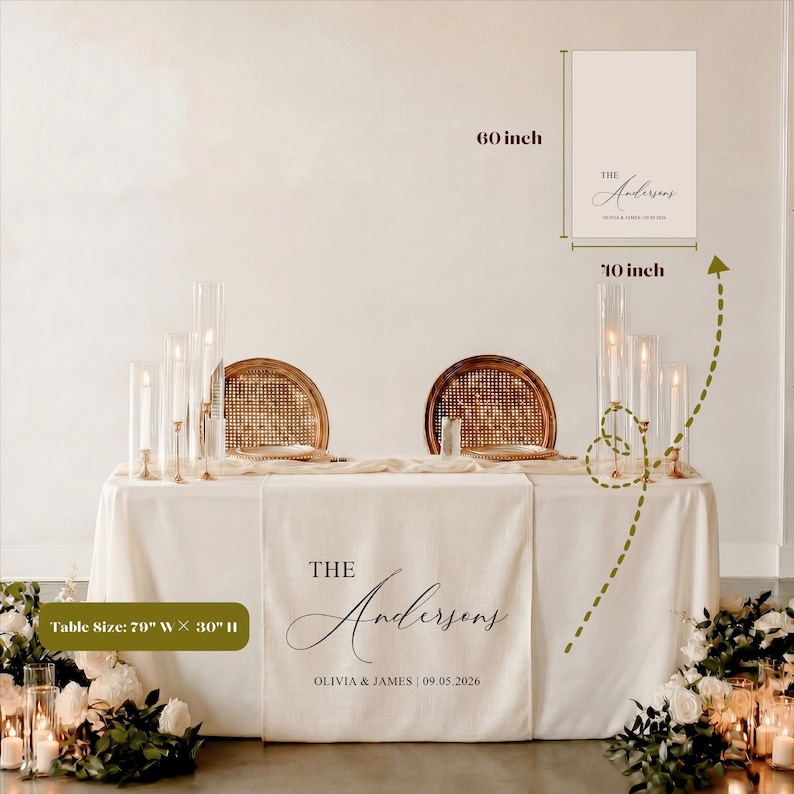 May include: A wedding table setting with a cream tablecloth and runner. The runner is personalized with "The Andersons" and the wedding date. The table is 200cm wide and 76cm high. Includes a sign that is 25cm x 152cm.