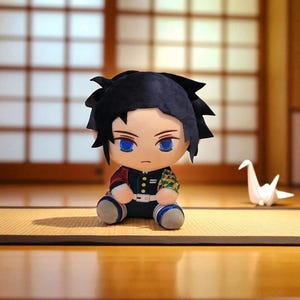May include: A plush doll of a character with black hair and blue eyes, dressed in a black and red outfit with a geometric pattern. The doll sits on a mat, with a white origami crane nearby. The background features a traditional Japanese-style sliding door.