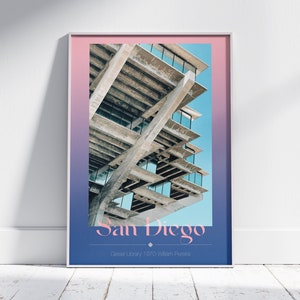 May include: A poster with a pink and blue gradient background featuring a photo of the Geisel Library in San Diego, California. The text "San Diego" is in a pink font and the text "Geisel Library 1970 William Pereira" is in a white font.