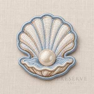 May include: An embroidered patch shaped like an open seashell with a central pearl. The design features light blue, cream, and tan thread colors with a scalloped edge and detailed stitching that defines the ridges of the shell and the round pearl.