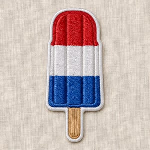 May include: An embroidered patch shaped like a popsicle with three distinct horizontal color sections. The top section is red, the middle is white, and the bottom is blue. A tan wooden stick extends from the bottom, all outlined in white thread.