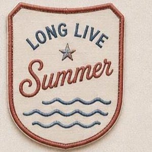 May include: A shield-shaped embroidered patch with a cream-colored background and a dark red border. The text reads LONG LIVE in dark blue, with a central star, and the word Summer in dark red script above three dark blue wavy lines.