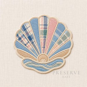 May include: Embroidered seashell design with a fan-like pattern in shades of blue, pink, and plaid fabrics. The design includes a beige border and a wavy blue base. The text "PRESERVE EAST" is printed in gray.