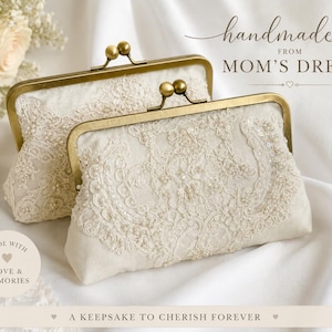 May include: Two off-white clutch purses with antique brass kiss-lock closures, featuring intricate lace overlays and beadwork. Text on image reads: handmade FROM MOM'S DRESS, MADE WITH LOVE & MEMORIES, A KEEPSAKE TO CHERISH FOREVER.