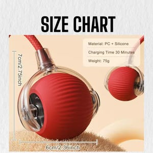 May include: A red, spherical product with a ribbed texture, encased in a clear, rounded shell. The product is 6 cm (2.36 inches) wide and 7 cm (2.75 inches) high. The text "SIZE CHART" is at the top. The product is made of PC and silicone and weighs 75g.