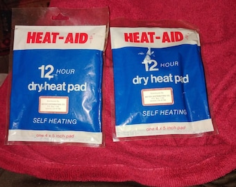 Cuscinetto riscaldante a secco vintage HEAT-AID autoriscaldante 12 ore 1981 Prop 4 X 6; Nuovo lotto di 2 RARO
