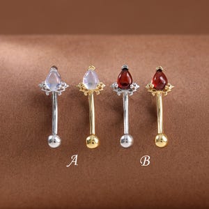 Pendiente de plata de ley con piedra lunar y granate en forma de lágrima • Anillo para ceja con rosca interna de piedras preciosas • Anillo para ombligo con barra curvada, calibre 16