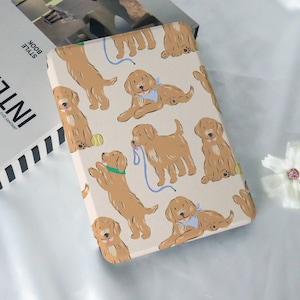 May include: A rectangular case featuring a repeating pattern of cartoon golden retrievers in various poses. The dogs are light brown with blue and green accents, some with leashes and tennis balls, set against a cream background.